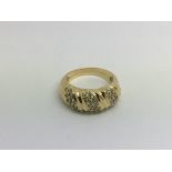 An 18ct gold ring set with thirty small diamonds,