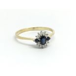 An 18ct yellow gold sapphire and diamond cluster r