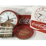 Five CocoCola advertising items including two cloc