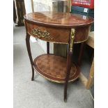 A Louis XVI style two tier side table with Ormolu