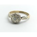 An 18ct yellow gold and diamond cluster ring, size