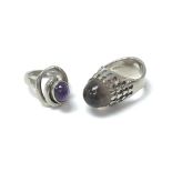 Two heavy silver rings set with amethyst and smoke