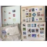 A box containing stamps, loose and in albums.