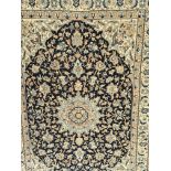 A Persian part silk rug with a geometric pattern w