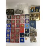 A collection of commemorative and old GB coins.