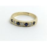 A 18ct yellow gold half eternity ring, consisting