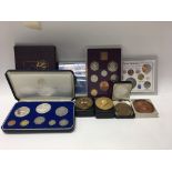 A collection of medallions and pre decimal British