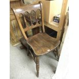 A vernacular chair with a solid seat.