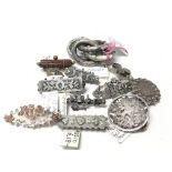 A collection of vintage silver brooches of various