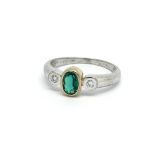 A 9ct white gold, green stone and diamond ring, ri