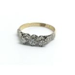 A 1930s three stone diamond ring, size approx K/L