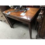 A mahogany folding topped tea table.