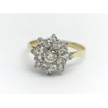 An 18ct yellow gold and diamond cluster ring, appr