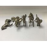 A collection of five silver cast animals, stag and