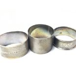 Three silver napkin rings Birmingham hallmarks. 67