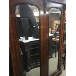 A large Victorian mahogany mirrored 2 door wardrob