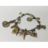 A gold charm bracelet made from a converted antiqu