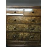 A Victorian walnut chest of drawers with two short