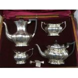 A cased four piece silver tea set with semi gadroo