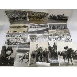 A collection of racing press photographs and a sig