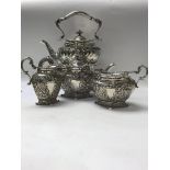 A four piece silver tea set comprising sprit kettl