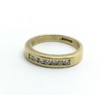 An 18ct yellow gold ring set with a single row of