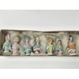 A collection of seven vintage 1920’s pin dolls