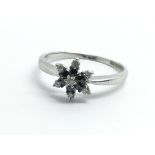 An 18ct white gold, diamond and sapphire cluster r