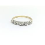 A 9ct yellow gold diamond ring, approx 0.12ct, rin