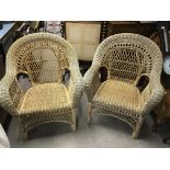 A pair of good quality wicker armchairs.