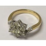 An 18ct yellow gold 7-stone diamond cluster ring.