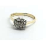 An 18ct yellow gold diamond cluster ring, approx 0