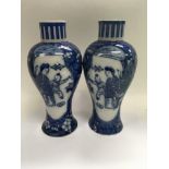 A pair of Chinese vases decorated with figures 23