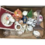 A box containing a collection of ceramics includin