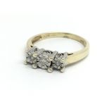 A 9ct yellow gold and three stone diamond ring, ap