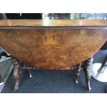 A Victorian walnut Sutherland table the twin flap