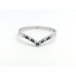 A 9ct white gold, diamond and sapphire wishbone sh