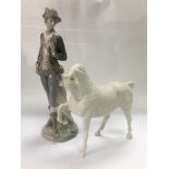 A Lladro figure of a gentleman and a Beswick figur