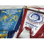 A collection of speedway pennants from 1970s mirro