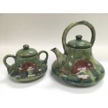 A Moorcroft teapot and matching sugar bowl in Clar