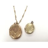 A 9carat gold front and back locket with an attach