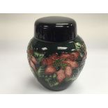 A small Moorcroft ginger jar and cover with polych