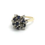 An 18ct yellow gold sapphire and diamond cluster r