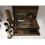 A cased wooden surgeons kits including scalpels, s