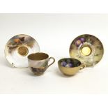 Two Royal Worcester cups and saucers bearing scene