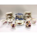 A set of six Royal Albert two handled cups and sau