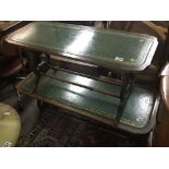 Two mahogany occasional tables with green leather