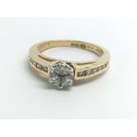 An 18ct yellow gold ring set with three marquise c