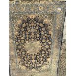 A hand knotted Persian part silk rug with a geomet