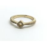 An 18ct yellow gold and diamond ring in modern des